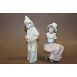 A LLADRO FIGURE OF A GIRL HOLDING A COCKREL TOGETHER WITH A NAO FIGURE OF A GIRL WITH A PUPPY (2)