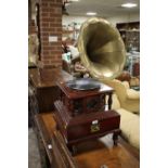 A HMV WIND UP GRAMOPHONE ON WOODEN STAND