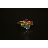 A BOXED 9 CT GOLD LADIES DRESS RING WITH COLOURED STONES