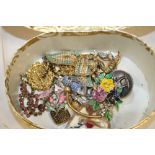 A SMALL BOX OF COSTUME JEWELLERY