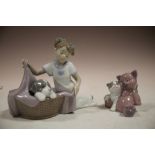 TWO NAO FIGURES; GIRL WITH DOG IN BASKET AND CAT WITH TEDDY BEAR