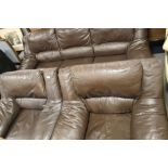 A BROWN LEATHERETTE THREE PIECE SUITE