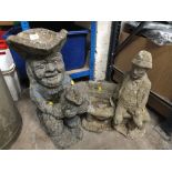 A TOBY JUG STYLE GARDEN ORNAMENT & ANOTHER (2)