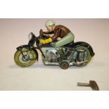 A VINTAGE WIND UP TIN PLATE 'ARNOLD' MAN ON MOTORBIKE