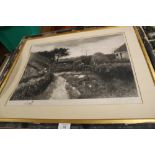 A VINTAGE FRAMED ENGRAVING DEPICTING A COUNTRY COTTAGE PLUS FIGURES SIGNED LOWER RIGHT