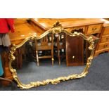 A LARGE GILT FRAMED OVER MANTLE MIRROR