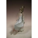 A LLADRO FIGURE OF A GIRL WITH CATS