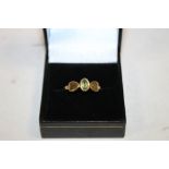 A 9CT GOLD PERIDOT DRESS RING