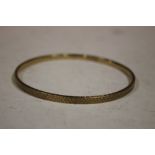 A 9CT GOLD BANGLE