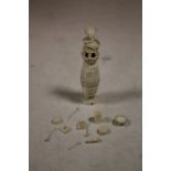 AN IVORY CONTAINER & MINIATURE CONTENTS