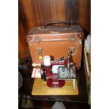 A CASED MINIATURE / VINTAGE ESSEX SEWING MACHINE