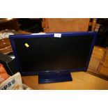 A SMALL BLUE FLATSCREEN TV