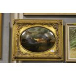 A 19TH CENTURY GILT FRAMED OVAL OIL PAINTING DEPICTING CATTLE WATERING