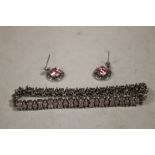 A SILVER PINK STONE BRACELET AND EARRINGS