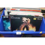 A QUANTITY OF ASSORTED RECORDS TO INCLUDE BOB MARLEY, BRUCE SPRINGSTEEN, UB40, MADNESS, ETC