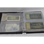 A COLLECTION OF WORLD BANK NOTES CONTAINED IN ALBUM. OVER 100 NOTES TO INCLUDE MANY UNC EXAMPLES, T