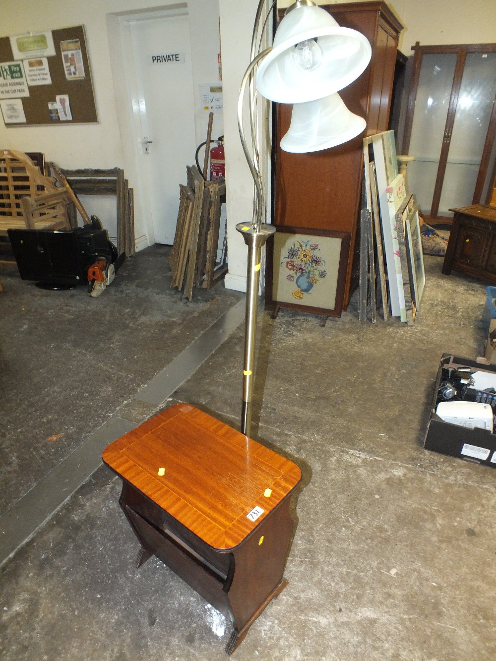A MODERN MAGAZINE TABLE AND STANDARD LAMP