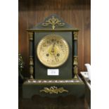 AN ANTIQUE BRONZE AND CHAMPLEVE ENAMEL MANTLE CLOCK