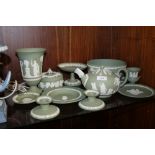 A SELECTION OF TWELVE PIECES OF GREEN WEDGWOOD JASPERWARE TO INCLUDE A TEAPOT, FRUIT BOWL ETC