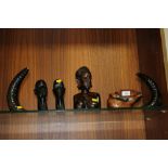 A SELECTION OF CARVED AFRICAN TRIBAL FIGURES , HORNS ETC