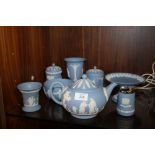 A SELECTION OF WEDGWOOD POWDER BLUE JASPERWARE TO INCLUDE A TEA POT, TABLE LIGHTER ETC.