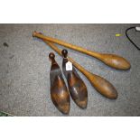 A PAIR OF WOODED SHOE FILLERS TOGETHER WITH A PAIR OF VINTAGE WOODEN JUGGLING STICKS