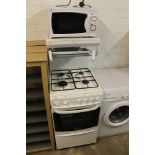 A WORCESTER GAS COOKER TOGETHER WITH A MICROWAVE