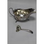 A HALLMARKED SILVER GRAVY BOAT AND SPOON