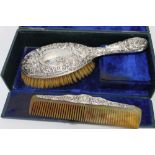 A HALLMARKED SILVER COMB AND BRUSH