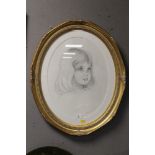 AN OVAL FRAMED AND GLAZED PENCIL DRAWING OF A YOUNG GIRL