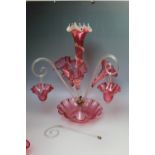 A LARGE VICTORIAN CRANBERRY GLASS EPERGNE, central frilled bowl and tall trumpet vase, with three f