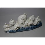 A CHINESE SCHOLARS BRUSH STAND IN THE FORM OF WAVES ON THE SEA, W 19.5 cm