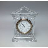 A WATERFORD CRYSTAL CASED MANTEL CLOCK, the architectural case with quartz movement having white di