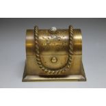 A 19TH CENTURY TYPE BRASS CASKET, with push button opening, rope style embellishment and set with a