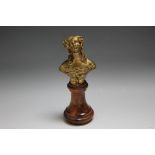 A SMALL GILT METAL BUST OF A LADY ON A TURNED WOODEN BASE, H 15 cm