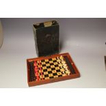 JAQUES OF LONDON - A MAHOGANY CASED TRAVELLING CHESS SET, with each side having a coloured press bu