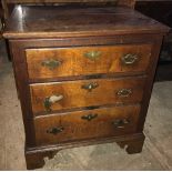 A SMALL 19TH CENTURY OAK CHEST OF DRAWERS, with three graduating drawers, on shaped bracket feet, H