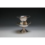 A SILVER PLATED TWIN HANDLED WINE COOLER, of typical form with gadrooned edging, H 24 cm