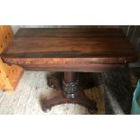 A 19TH CENTURY ROSEWOOD FOLD OVER CARD TABLE. the hinged top with baize lined interior, supported o