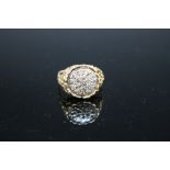 A HALLMARKED 18 CARAT GOLD AND DIAMOND RING, the brilliant cut diamond being set in a pave style on