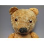 A EARLY 20TH CENTURY MOHAIR TEDDY BEAR, in pre-loved condition, blond mohair, fully jointed, rexin