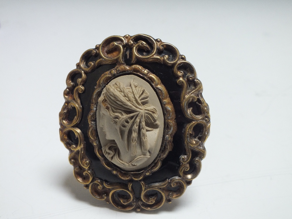 A VICTORIAN CARVED LAVA MEMORIAL BROOCH, of oval form with black enamel and scrolling yellow metal - Image 3 of 6