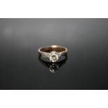 AN 18CT AND PLATINUM DIAMOND SOLITAIRE RING, set with a brilliant cut diamond of approx 0.20 carat,