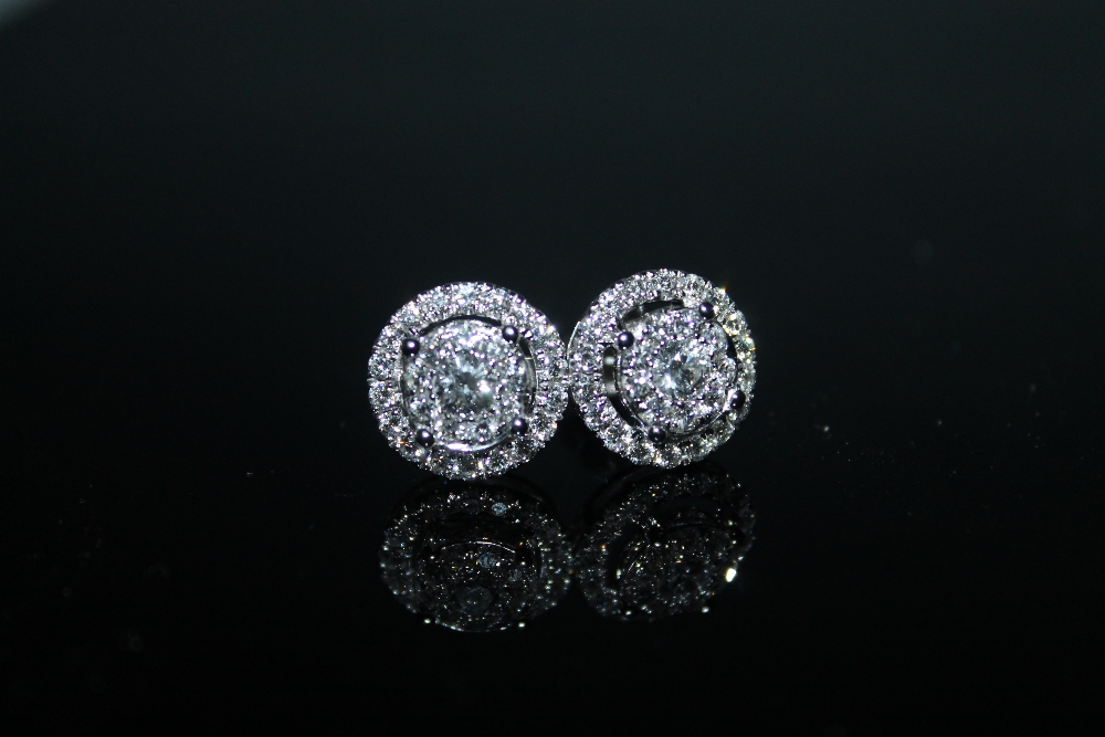 A PAIR OF HALLMARKED 18 CARAT WHITE GOLD DIAMOND CLUSTER EARRINGS, set with brilliant cut diamonds - Image 2 of 2