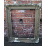 AN ANTIQUE GILTWOOD PICTURE FRAME WITH MOULDED DETAIL, rebate 70 x 90 cm A/F