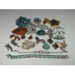 A COLLECTION OF VINTAGE COSTUME JEWELLERY, comprising fifteen brooches to include signed examples,