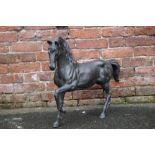 A CAST BRONZED STYLE FIGURE OF A HORSE, W 73 cm, H 59 cm