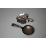 A HALLMARKED SILVER CADDY SPOON - BIRMINGHAM 1823, makers mark IT, together with another (2)