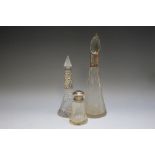 TWO HALLMARKED SILVER COLLARED SCENT BOTTLES, together with a screw top example (3)