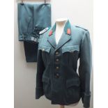 A 20TH CENTURY GERMAN MILITARY UNIFORM, comprising jacket - chest 38" and trousers - waist 32", in